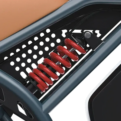 Close-up of red coil spring shock absorber in black and gray electric bike frame
