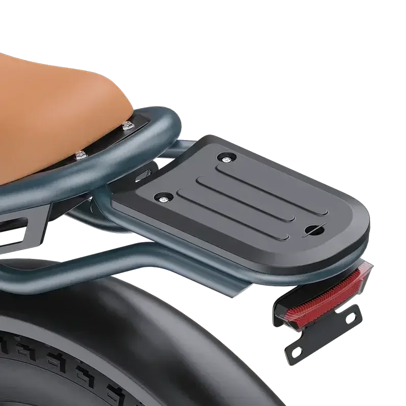 Close-up of black metal rear luggage rack with four mounting holes on electric scooter seat